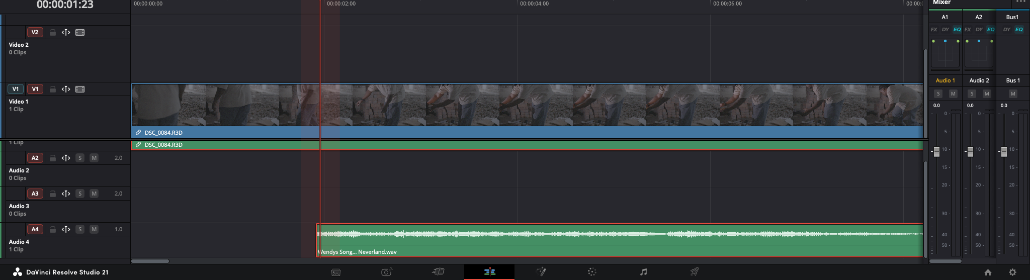 DaVinci Resolve timeline — a 6K R3D on Video 1, its on-set scratch audio on Audio 1–2, and the master song 'Wendys Song… Neverland' on Audio 4, all placed by the scripting bridge.
